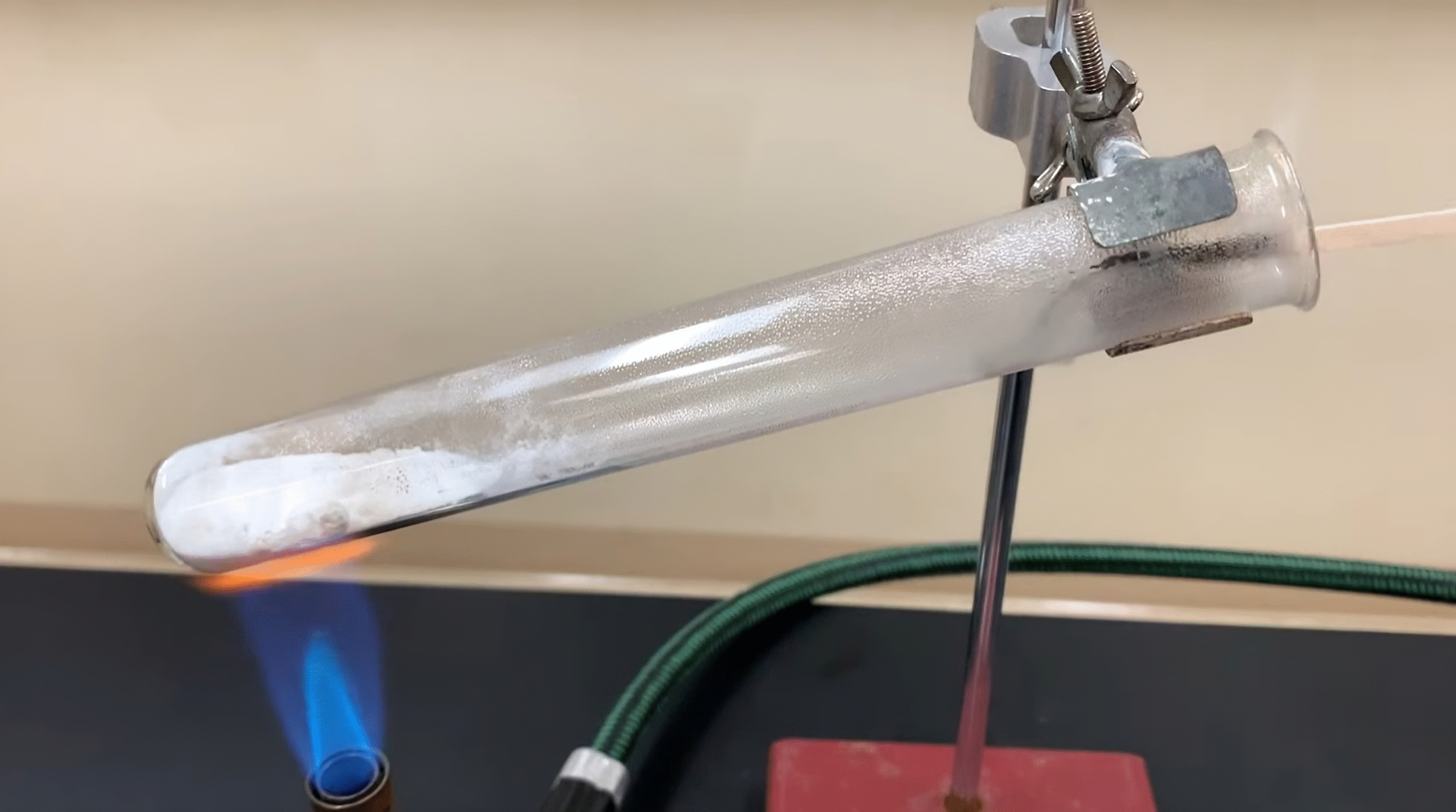 The gas produced by the thermal decomposition of baking soda extinguishes the flame.